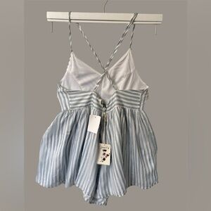 Poof! Elegant jumpsuit with white and blue stripes.
for girls, size M